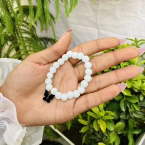 White Beaded Bracelet with Black Butterfly Charm – Minimal Chic